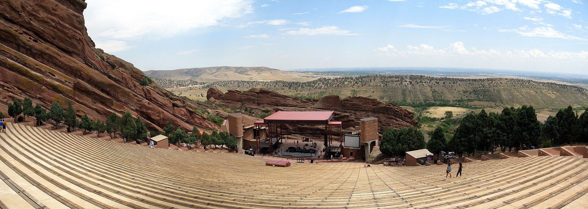 Wide panorama of the Red Rocks stage and seating between the rock formations.