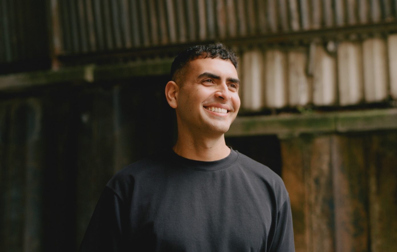 Sammy Virji, head and shoulders, smiling.
